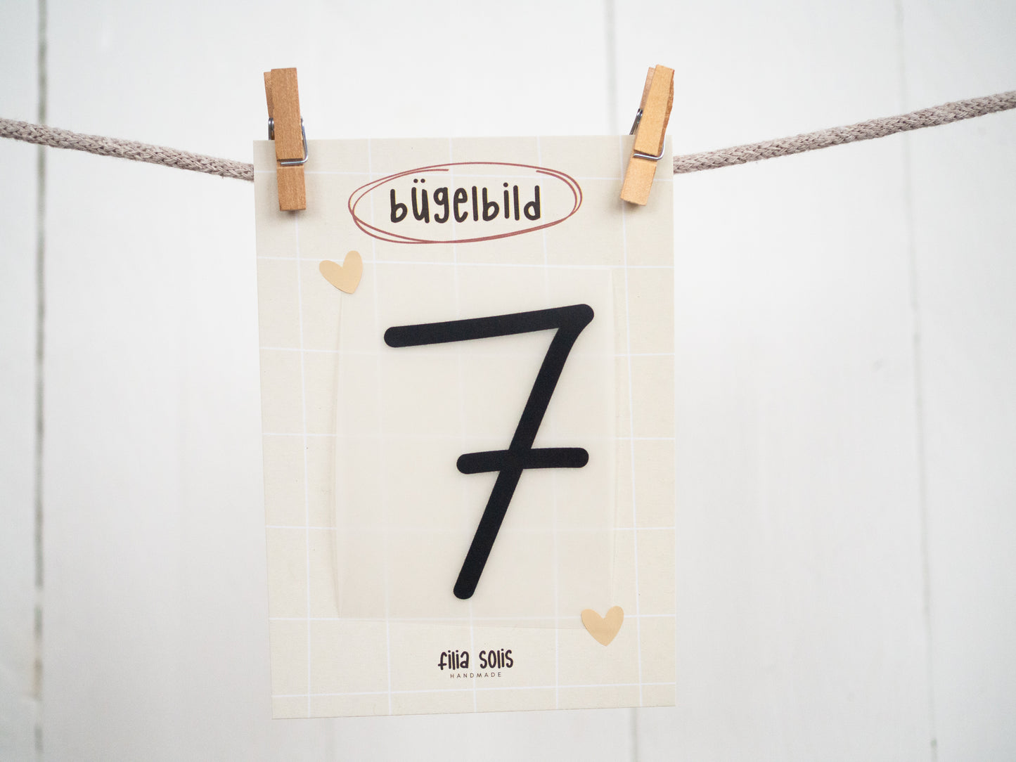 Bügelbild sieben (schwarz)